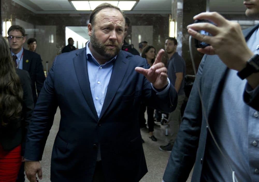Radio host Alex Jones walks in Capitol Hill after Facebook COO Sheryl Sandberg and Twitter CEO Jack Dorsey appeared at a hearing before the Senate Intelligence Committee on 'Foreign Influence Operations and Their Use of Social Media Platforms' on Sept. 5. (Jose Luis Magana/AP)
