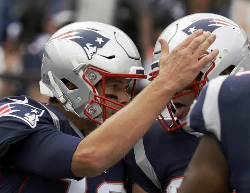 New England Patriots quarterback Tom Brady, left, celebrates his touchdown pass to Rob Gronkowski, right, during the first half of an NFL football game against the Houston Texans, Sunday, Sept. 9, 2018, in Foxborough, Mass. (Charles Krupa/AP)