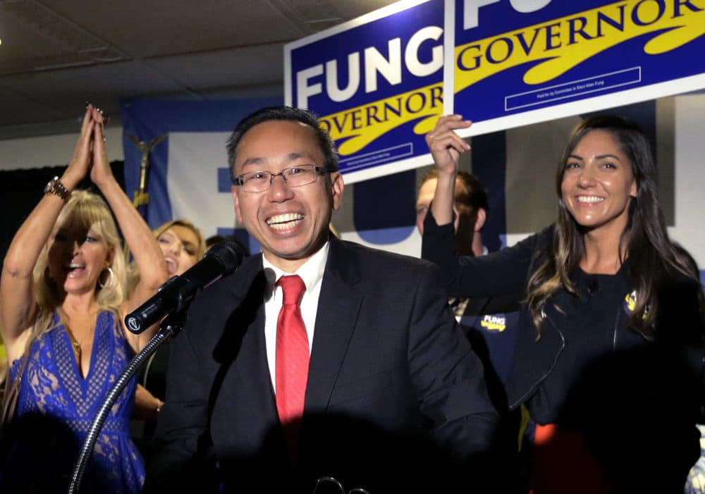 Cranston, R.I., Mayor Allan Fung, center, celebrates victory over R.I. House Minority Leader Patricia Morgan in the Republican gubernatorial primary, Wednesday, Sept. 12, 2018, in Cranston, R.I. (Steven Senne/AP)