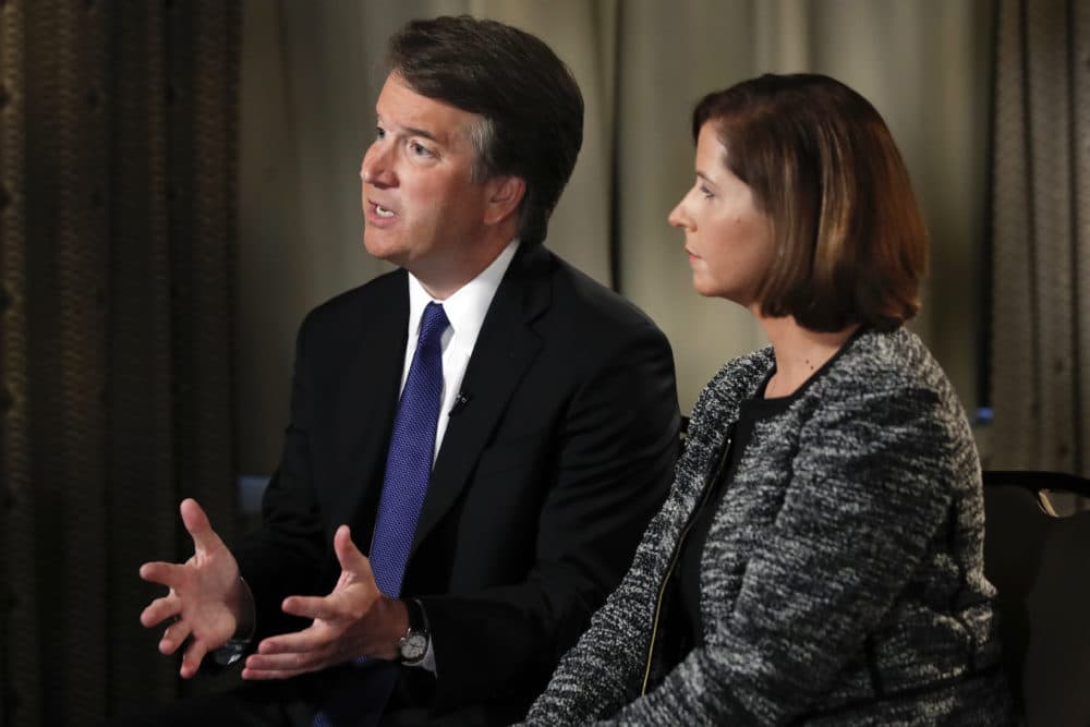 Brett Kavanaugh, with his wife Ashley Estes Kavanaugh, answers questions during a FOX News interview, Monday, about allegations of sexual misconduct against the Supreme Court nominee. (Jacquelyn Martin/AP)