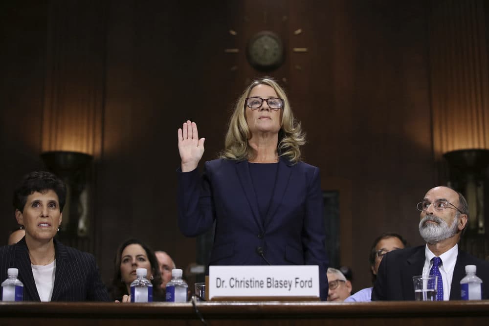 Christine Blasey Ford is sworn in before the Senate Judiciary Committee, Thursday, Sept. 27, 2018 in Washington. Her attorney's Debra Katz and Michael Bromwich watch. (Win McNamee/AP)