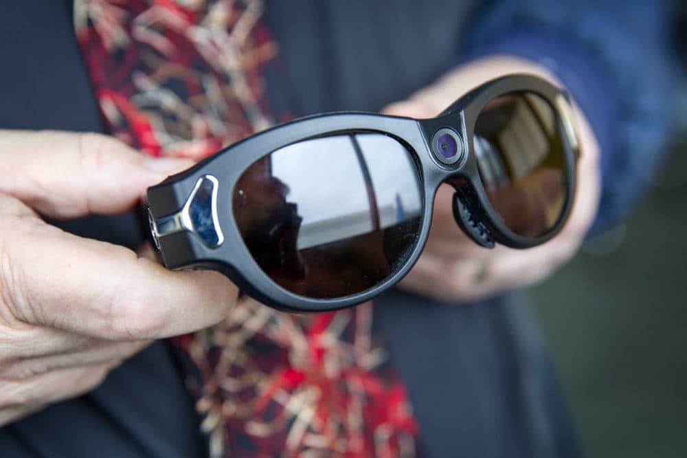 These glasses have a camera built into the bridge over the wearer's nose, so that a remote viewer can see what is happening in front of the person wearing the glasses. (Robin Lubbock/WBUR)