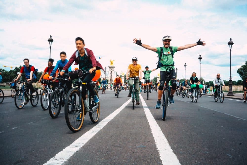 People riding bikes in Paris (FredPixlab/Unsplash)