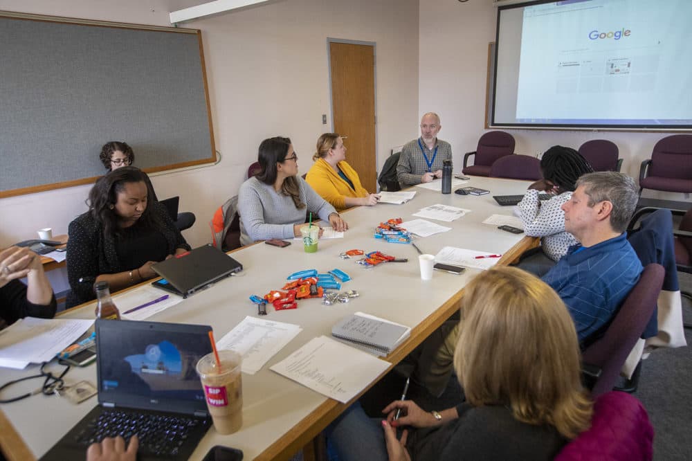 Members of the Chronic Working Group meet every week to discuss clients on Boston's chronically homeless list and efforts to get them into permanent supportive housing. (Jesse Costa/WBUR)