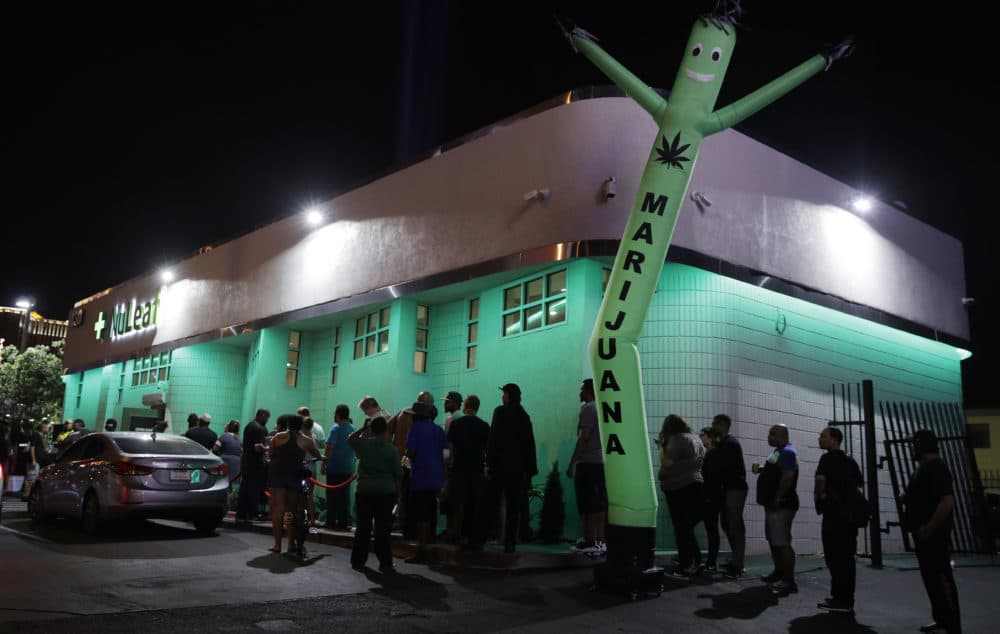 In this July 1, 2017, file photo, people line up at the NuLeaf marijuana dispensary in Las Vegas. (John Locher/AP)