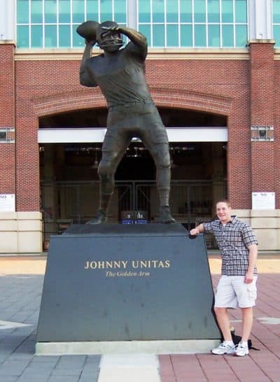 Rich Ellenson -- circa 2004? -- with the statue of Johnny Unitas outside the Baltimore Ravens stadium. (Courtesy Rich Ellenson)