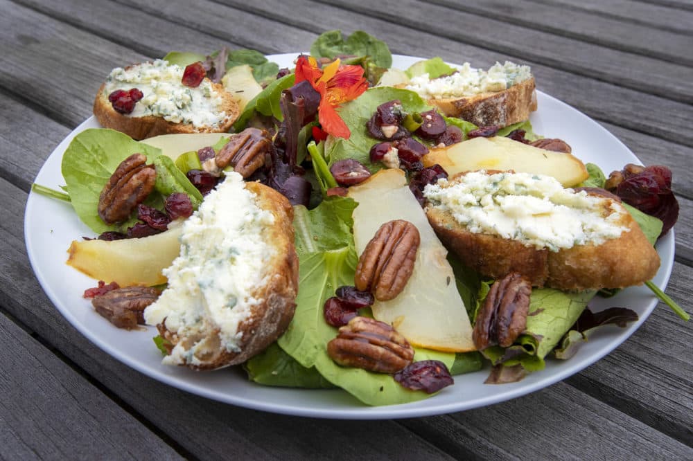 Spinach salad with roasted pears, blue-cheese toasts and caramelized maple pecans with sun-dried cranberry vinaigrette. (Jesse Costa/WBUR)