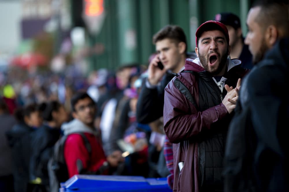 Fans react to Eduardo Núñez’s three-run homer in the seventh inning to put the Red Sox up 8-4 over the Dodgers. (Jesse Costa/WBUR)