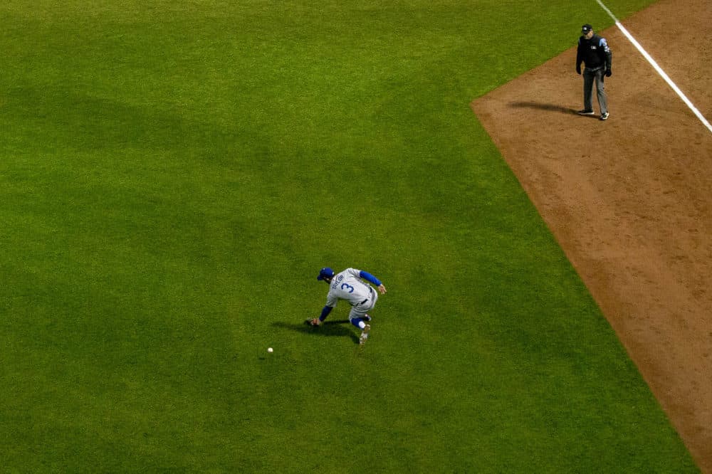 A ball hit by Andrew Benintendi slips past Dodgers leftfielder Chris Taylor in the third inning. (Jesse Costa/WBUR)