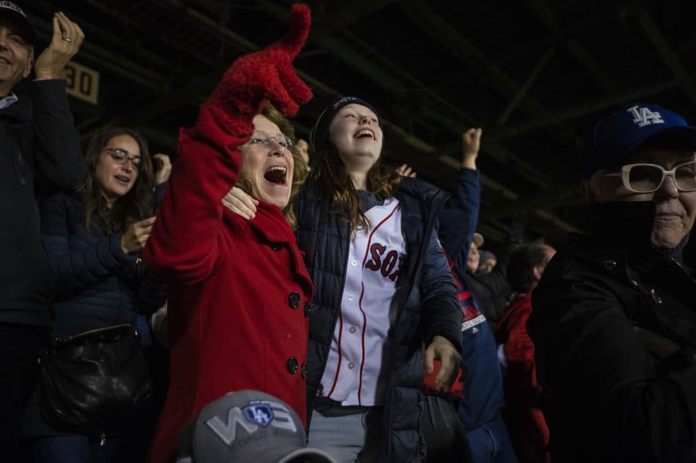 Fans react to Eduardo Núñez’s three-run homer in the seventh inning to put the Red Sox up 8-4 over the Dodgers. (Jesse Costa/WBUR)