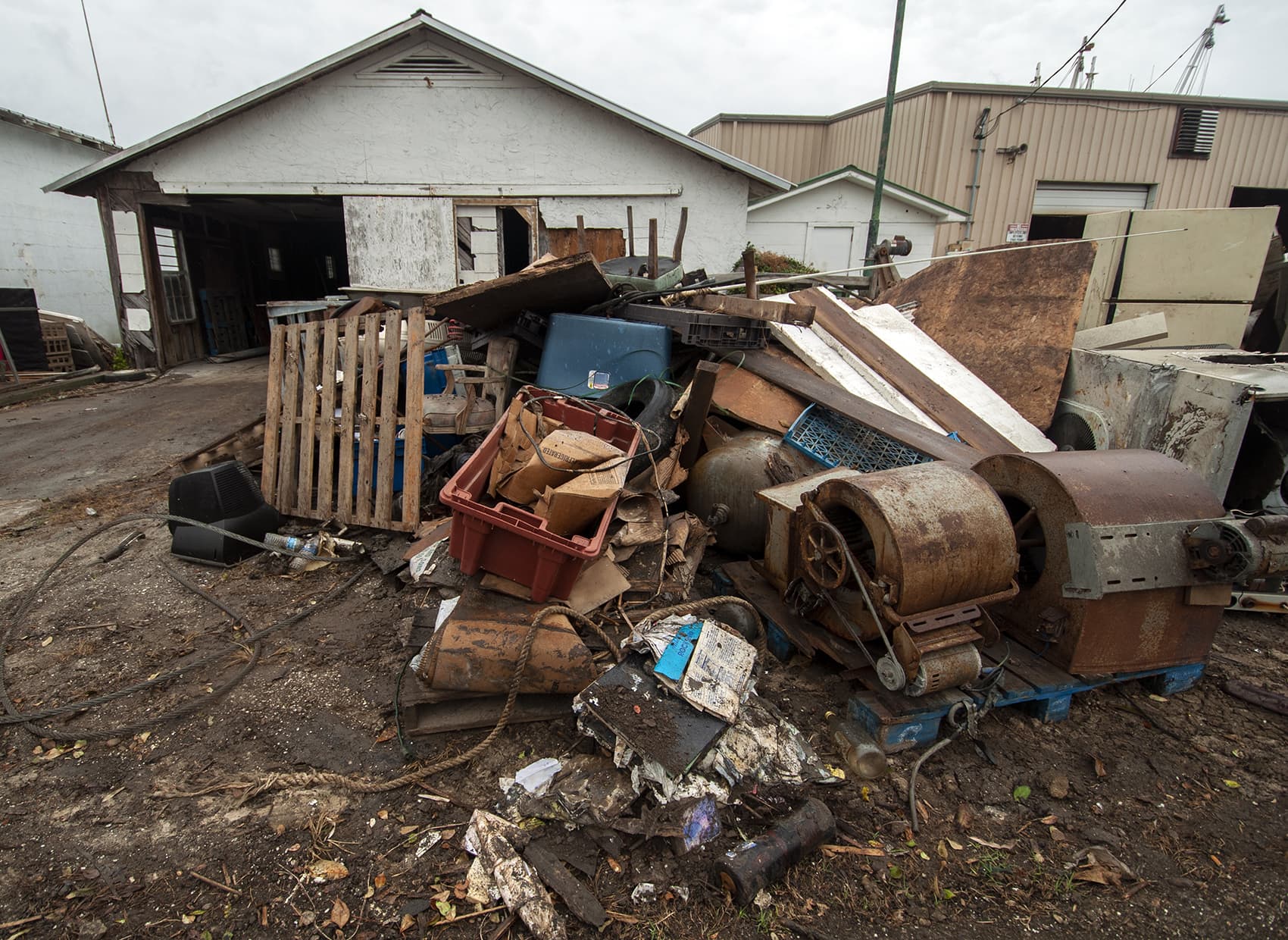 Debris in front of 13 Mile Seafood in Apalachicola, Fla. (Chris Bentley/Here &amp; Now)