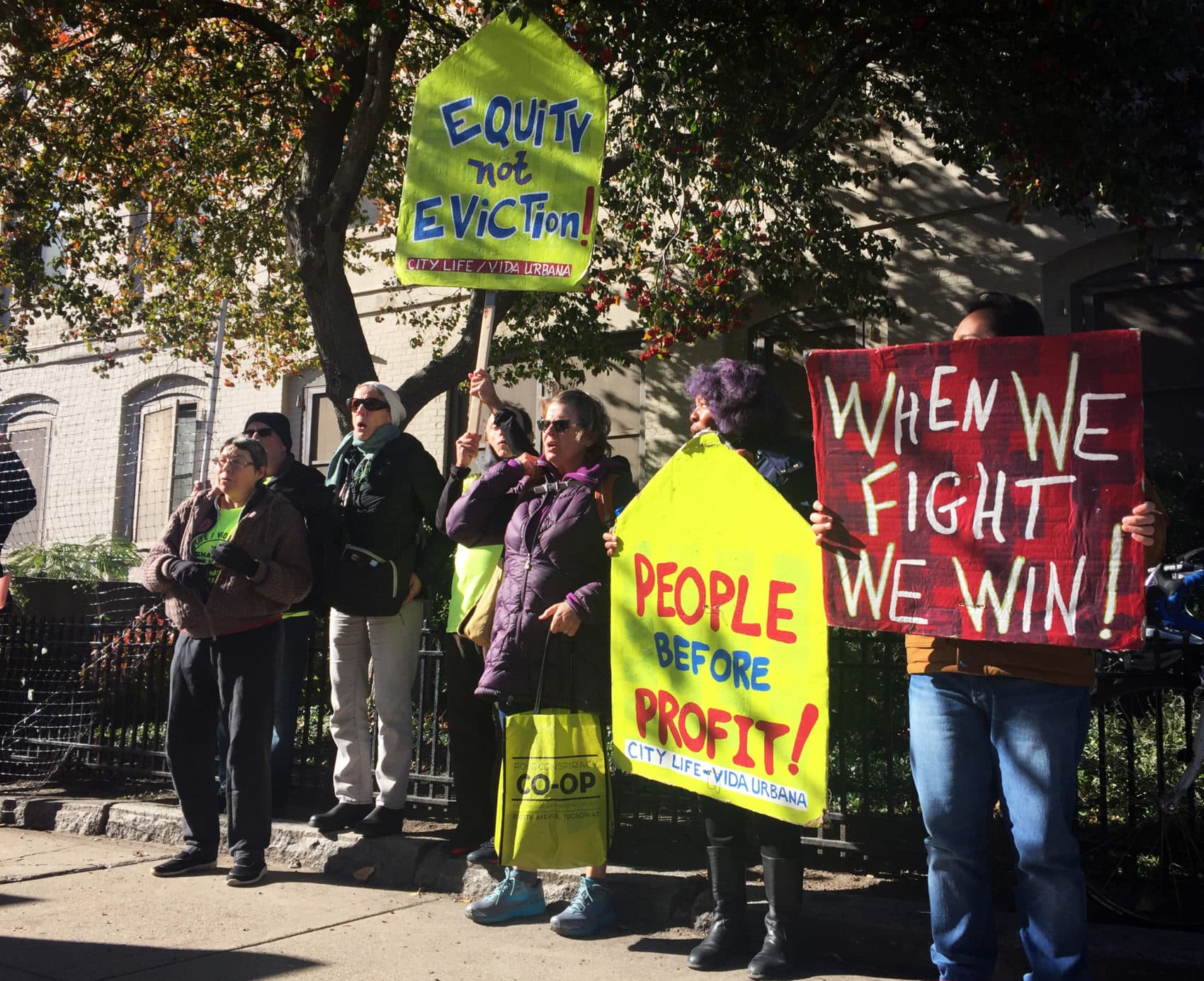 Artists and protesters demonstrate in front of the Piano Craft Guild building in Boston's South End. (Amelia Mason/WBUR)