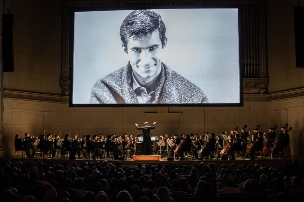 Keith Lockhart leads the Boston Pops as &quot;Psycho&quot; screens overhead on Monday night. (Courtesy Aram Boghosian)
