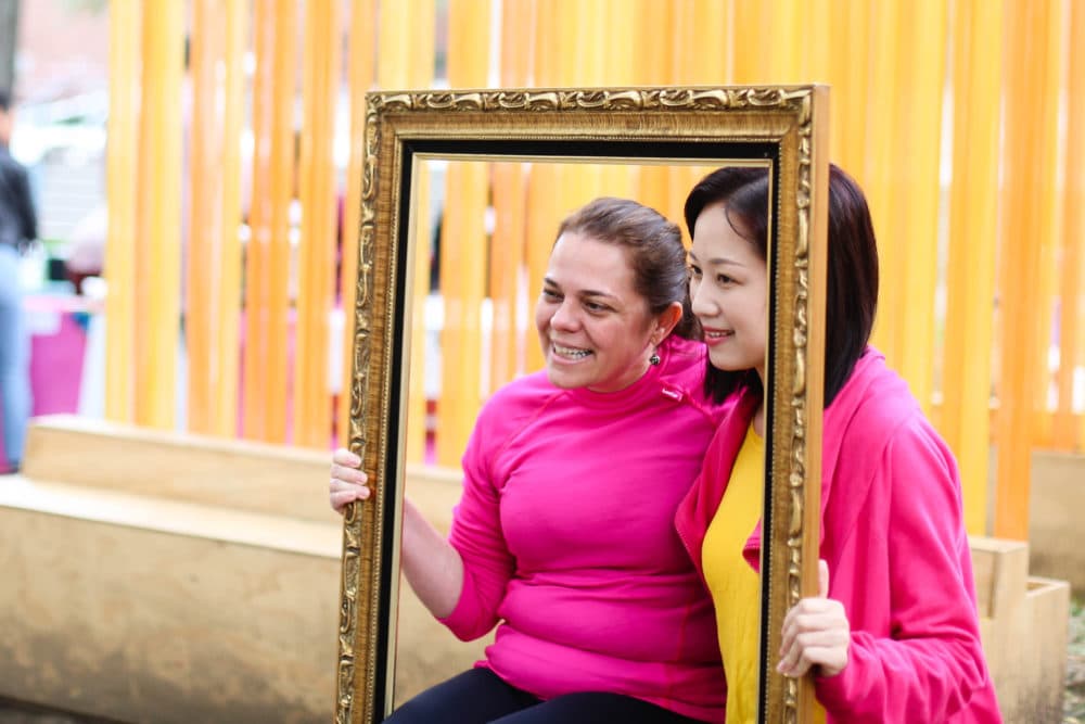 Marta Morais Pacheco from Brazil (L) and Rita Chen from Taiwan pose for their portrait. The two met the morning of Sept. 23 at their hostel and decided to explore the city together. Pacheco felt a pull from the environment and decided to check it out. (Courtesy A.R.T.)