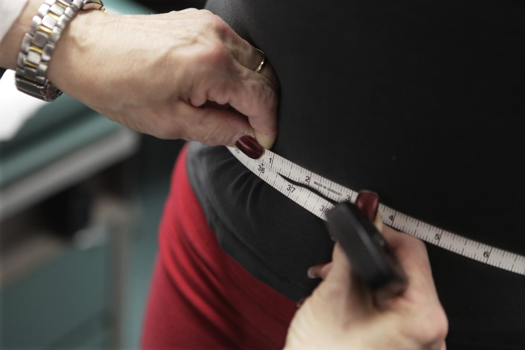 FILE - In this Jan. 20, 2010, file photo, a waist is measured during an obesity prevention study in Chicago. (AP Photo/M. Spencer Green, File)