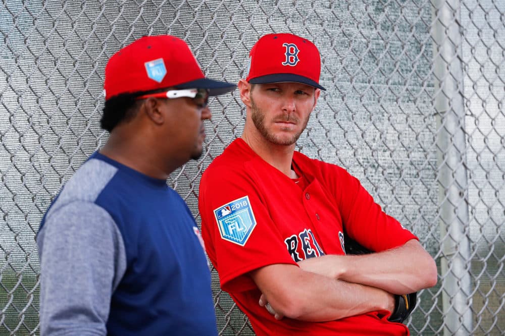 Boston Red Sox starting pitcher Chris Sale, right, listens to Pedro Martinez during spring training on Feb. 14 in Fort Myers, Fla. (John Minchillo/AP)