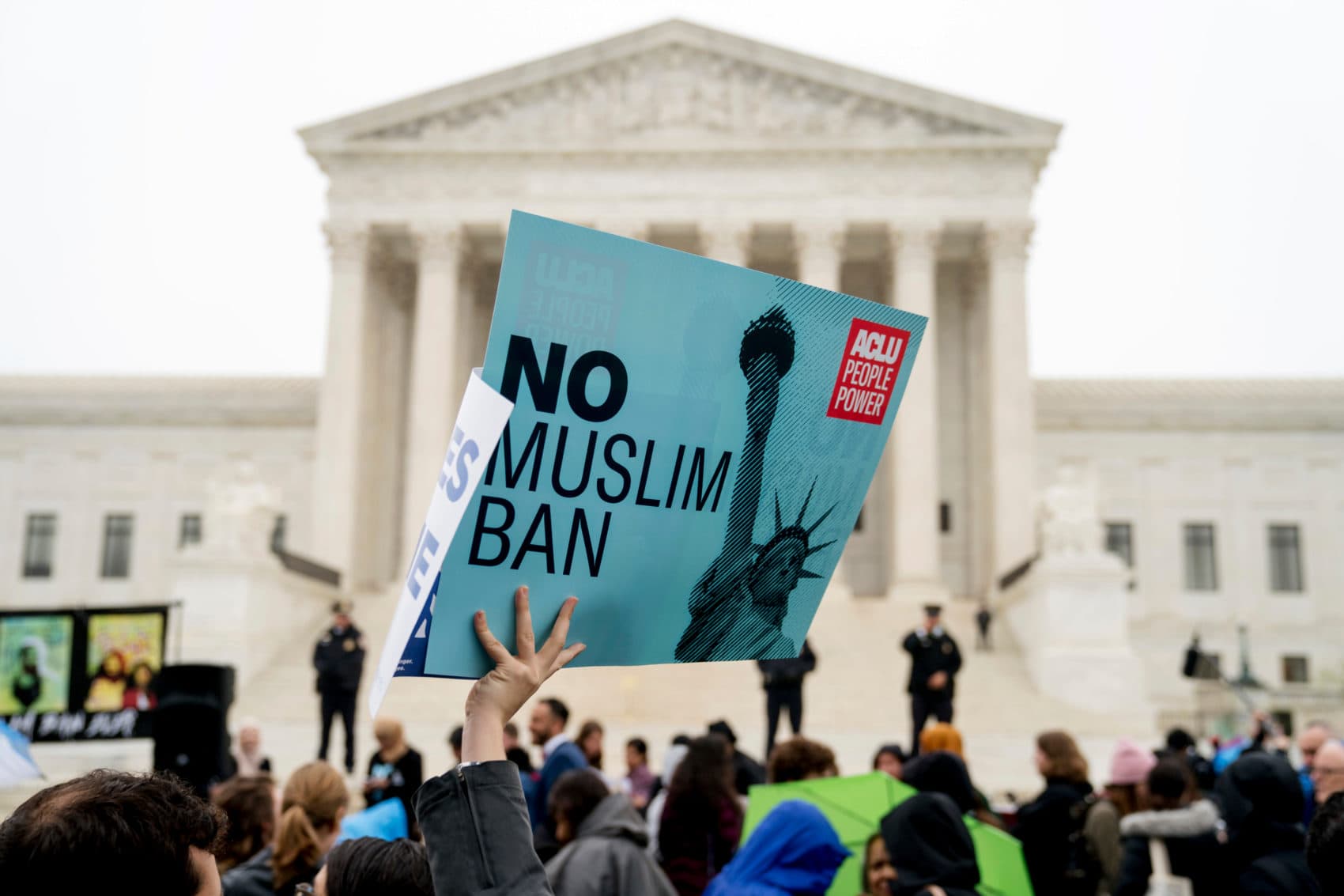In this April 25, 2018 file photo, a person holds up a sign that reads "No Muslim Ban" during an anti-Muslim ban rally as the Supreme Court hears arguments about wether President Donald Trump's ban on travelers from several mostly Muslim countries violates immigration law or the Constitution in Washington. (Andrew Harnik/AP)