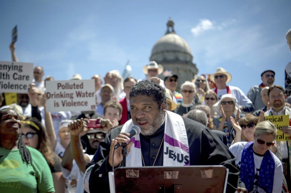 Reverend William J. Barber speaks to protesters gathered during a protest organized by Kentucky Poor People's Campaign in Frankfort, Kentucky, Monday, June 4, 2018 (Bryan Woolston/AP)