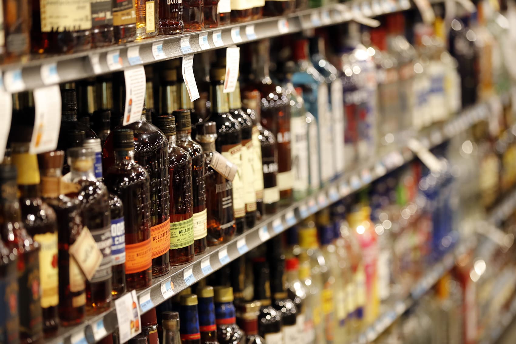 Liquor bottles are seen on display at a grocery store in River RIdge, La., Wednesday, July 11, 2018. (AP Photo/Gerald Herbert)