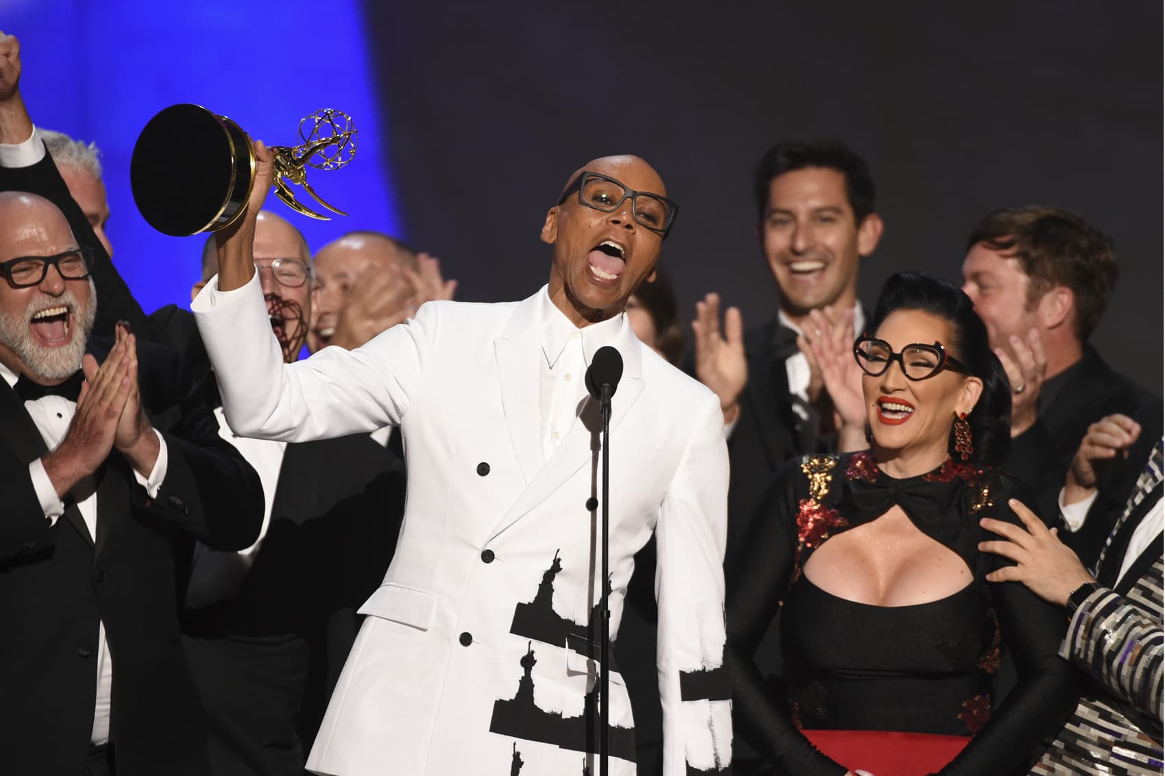 RuPaul Charles, front center, and the team from "RuPaul's Drag Race" accept the award for outstanding reality/competition program at the 70th Primetime Emmy Awards on Monday, Sept. 17, 2018, at the Microsoft Theater in Los Angeles. (Photo by Phil McCarten/Invision for the Television Academy/AP Images)