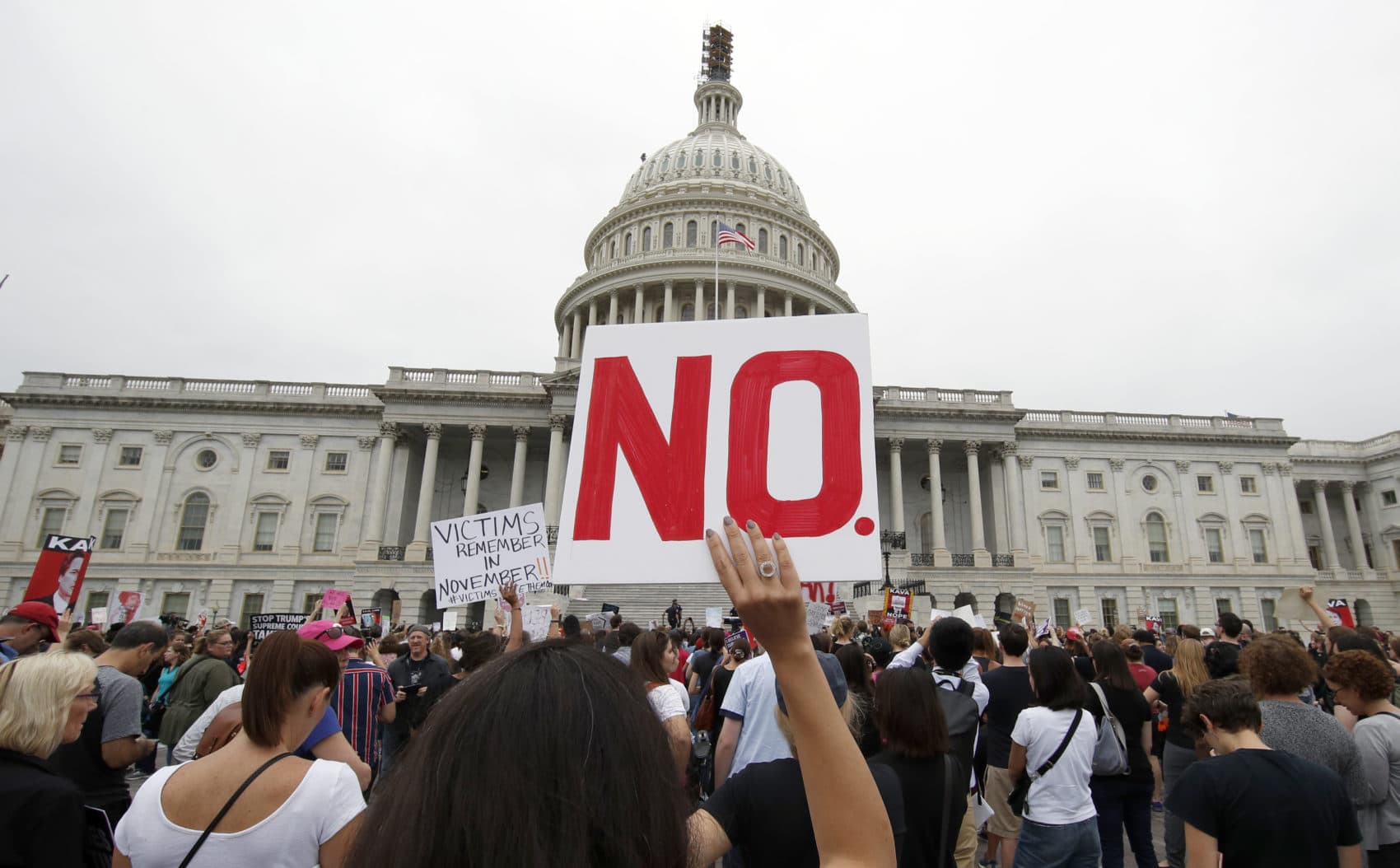 Activists demonstrate in the plaza of the East Front of the U.S. Capitol to protest the confirmation vote of Supreme Court nominee Brett Kavanaugh on Capitol Hill, Saturday, Oct. 6, 2018 in Washington. (Alex Brandon/AP)