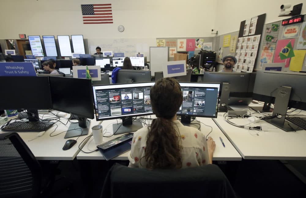 Lexi Sturdy, election war room lead, sits at her desk during a demonstration in the war room, where Facebook monitors election related content on the platform, in Menlo Park, Calif., Wednesday, Oct. 17, 2018. (Jeff Chiu/AP)