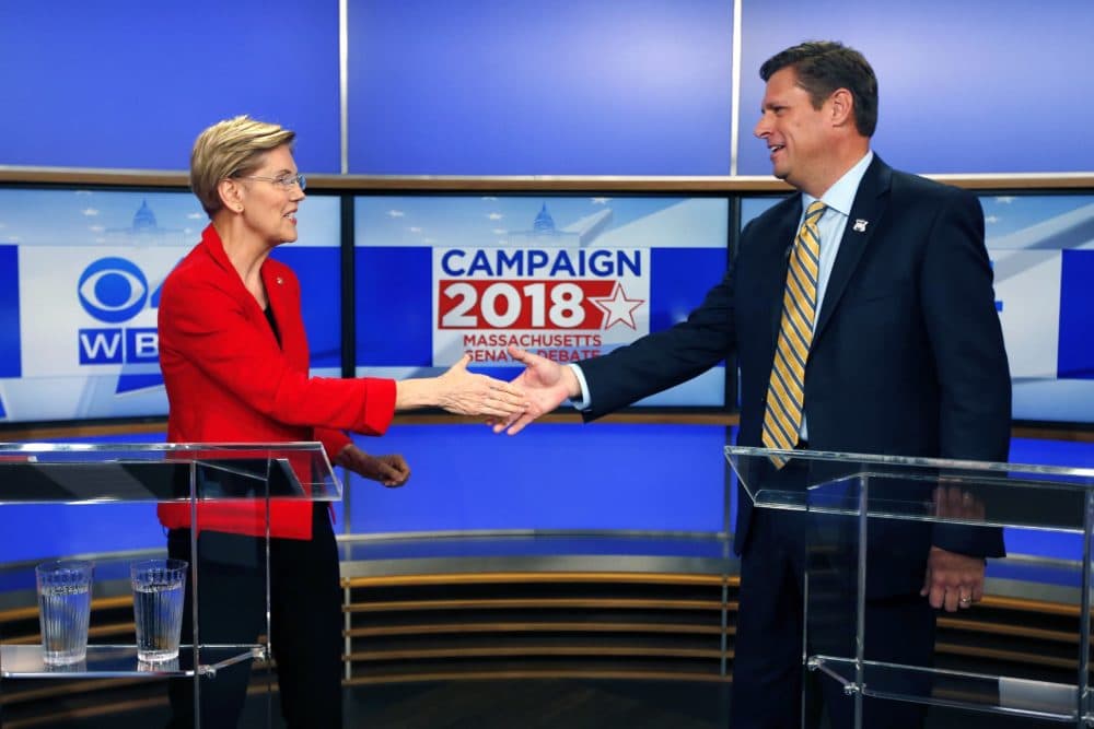 Massachusetts Senate candidates Sen. Elizabeth Warren, left, and her opponent State Rep. Geoff Diehl shake hands before a debate in Boston in 2018. (Michael Dwyer/AP)