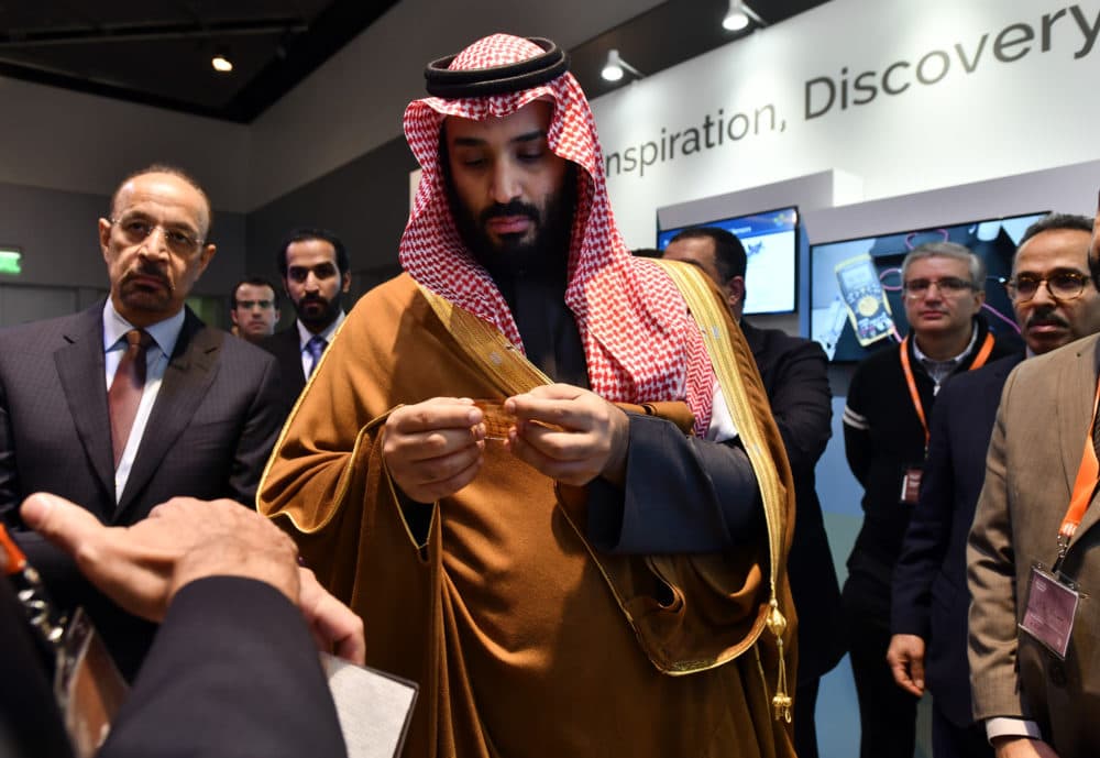 In this March 24, 2018, photo, Saudi Arabia Crown Prince Mohammed bin Salman tours an innovation gallery of Saudi Arabian technology, including an exhibit by King Abdullah University of Science and Technology, during a visit to Massachusetts Institute of Technology in Cambridge, Mass. While some U.S. colleges rethink their ties to Saudi Arabia, many more have shown no signs of backing away. An Associated Press analysis of federal data finds that 38 schools received at least $359 million from the Saudi government from 2011 through 2017. (Josh Reynolds/AP Images for KAUST)