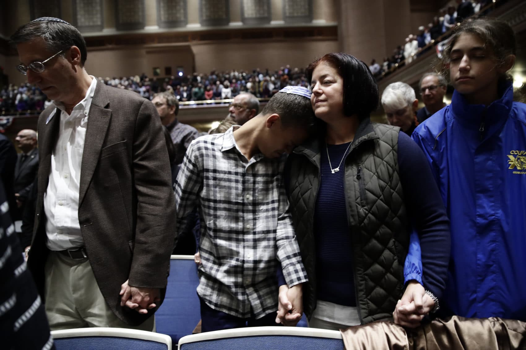 People mourn in Soldiers and Sailors Memorial Hall and Museum during a community gathering held in the aftermath of Saturday's deadly shooting at the Tree of Life Synagogue in Pittsburgh, Sunday, Oct. 28, 2018. (Matt Rourke/AP)