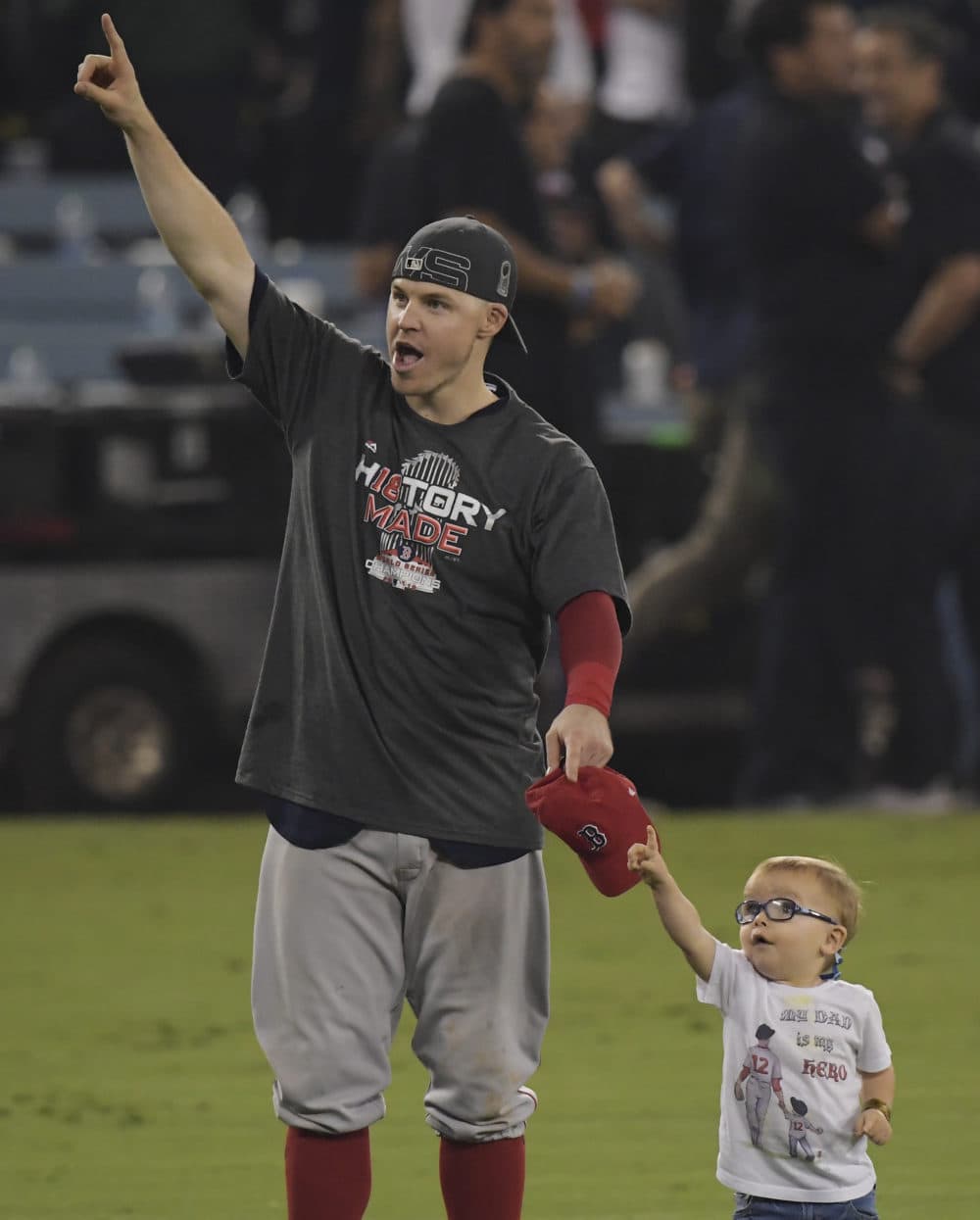 Boston Red Sox's Brock Holt celebrates with his son Griffin after Game 5. (Mark J. Terrill/AP)