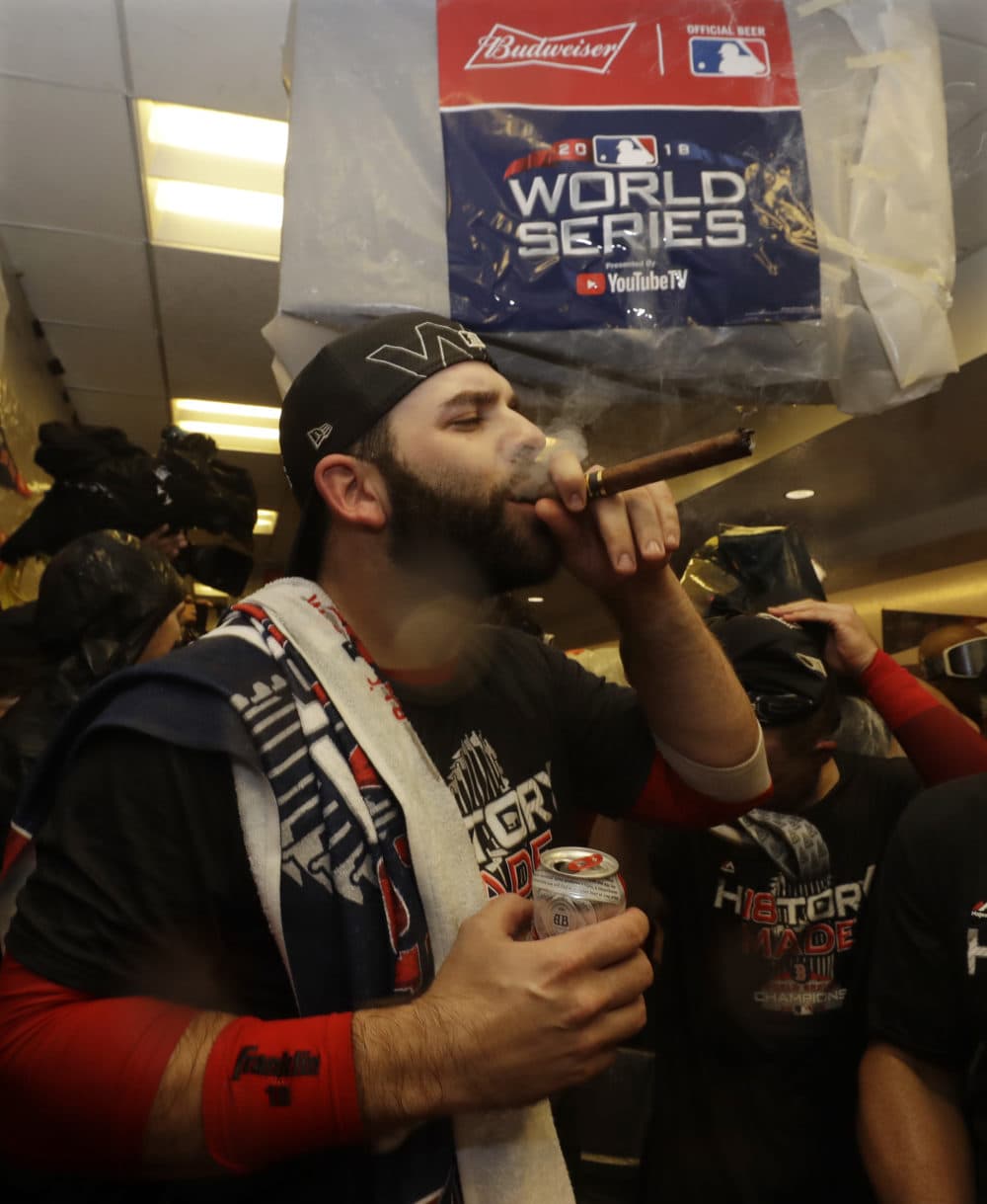 The Boston Red Sox celebrate in the clubhouse after Game 5 of baseball's World Series. (Elise Amendola/AP)