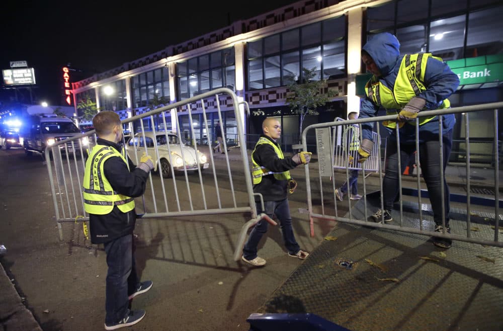 Boston police cadets place crowd-control barriers on streets around Fenway Park, in Boston, Sunday, Oct. 28, 2018. (Steven Senne/AP)