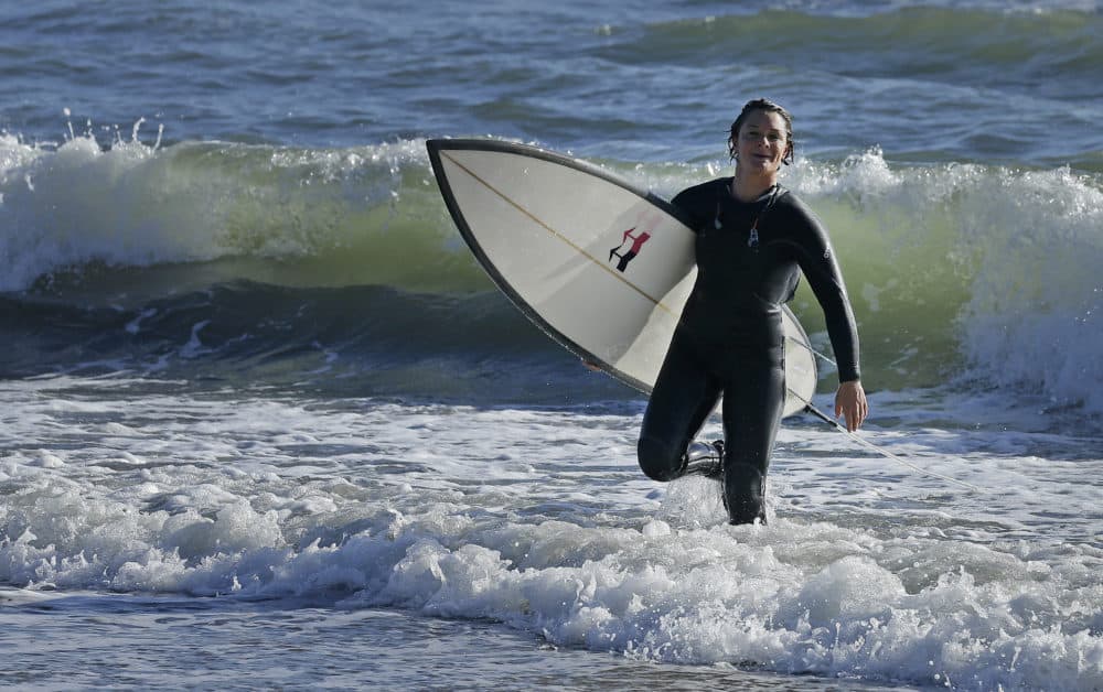 Bianca Valenti walks in from the ocean after surfing waves at Mavericks on Dec. 4, 2015, in Half Moon Bay, Calif. (Ben Margot/AP)