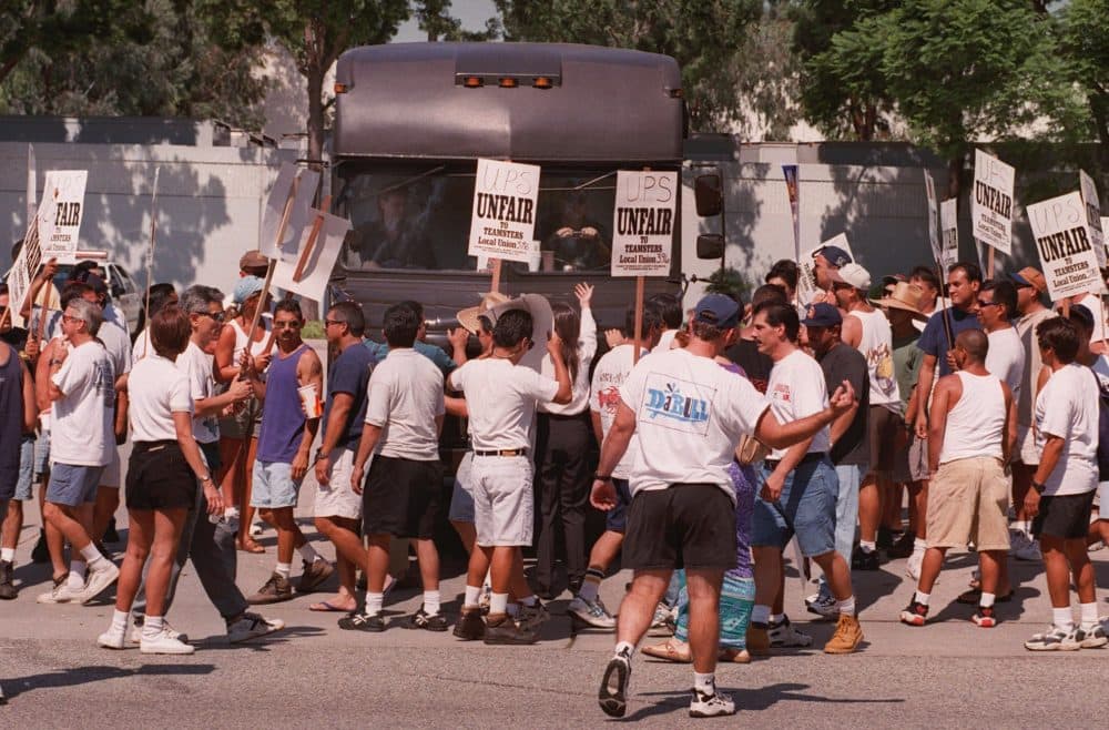 Striking United Parcel Service workers block the path of a UPS delivery truck attempting to leave a delivery station in Cerritos, Calif., Monday, Aug. 4, 1997. The walkout by more than 185,000 teamsters marks the first nationwide strike in the 90-year history of United Parcel Service which delivers 12 million parcels and documents per day. (E.J. Flynn/AP)