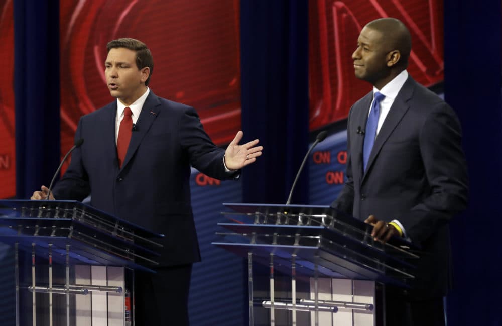 Florida Republican gubernatorial candidate Ron DeSantis, left, speaks about his Democratic opponent Andrew Gillum during a CNN debate on Sunday in Tampa, Fla. (Chris O'Meara-Pool/Getty Images)