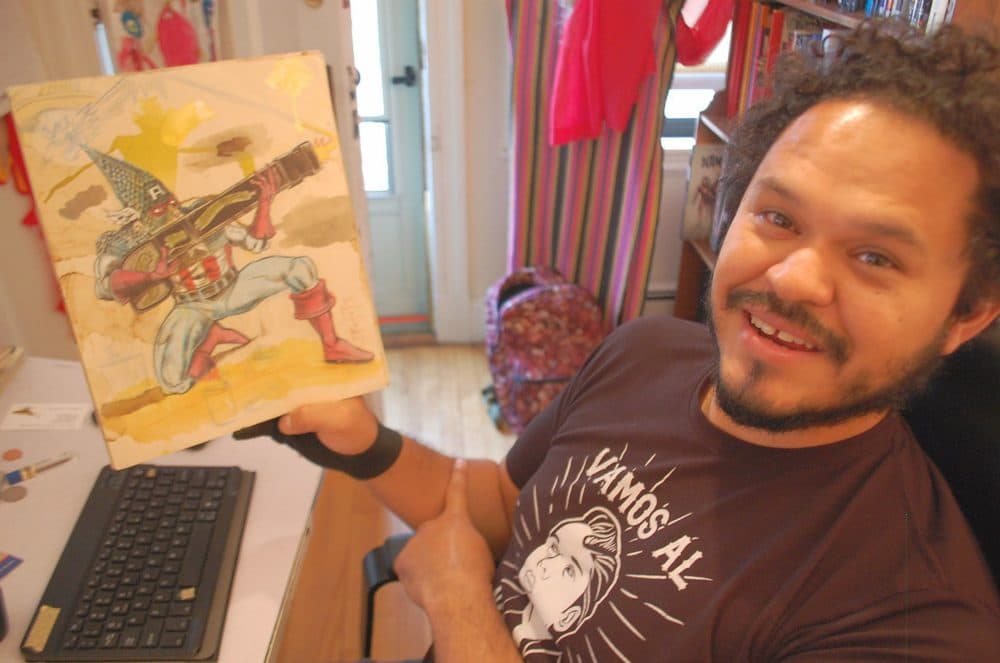 Medford artist Raul Gonzalez III at his home studio (Dana Forsythe for WBUR)