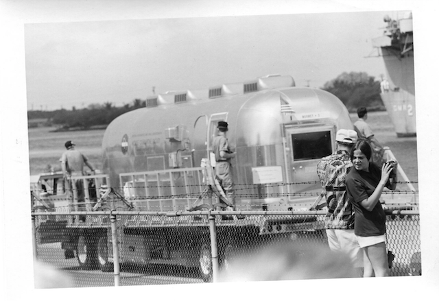 Maria Lane (right) and her Uncle Frank (second from right) watch as the Apollo 11 crew rides by in the NASA Mobile Quarantine Facility in Oahu, Hawaii, 1969. (Courtesy Maria Lane)