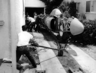 Craig guides the tow rig as his jet car is moved out of his dad’s garage. (Courtesy Craig Breedlove)