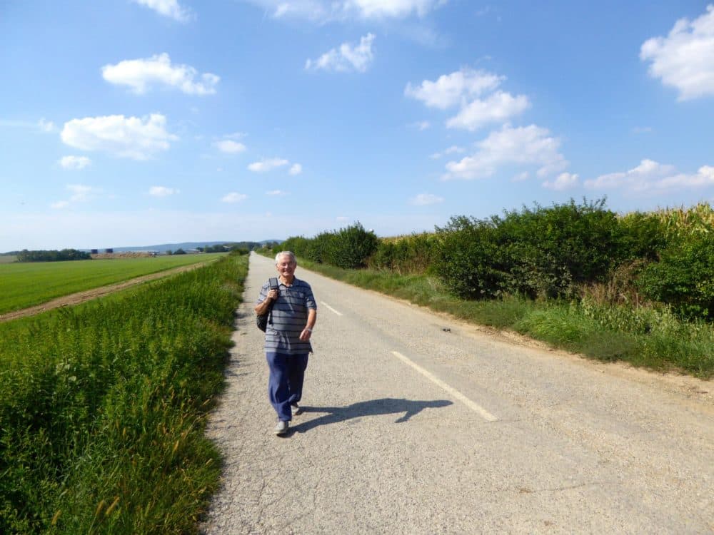 Tomi Reichental walking on the road in Slovakia near his hometown of Merašice in summer 2016. (Courtesy)