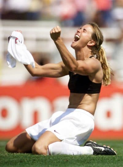 Brandi Chastain celebrates after kicking the winning penalty shot. (ROBERTO SCHMIDT/AFP/Getty Images)