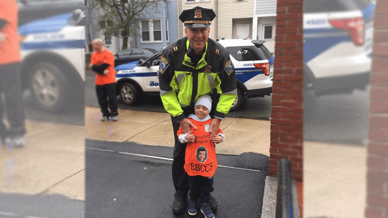 Christopher Chavarria poses with Capt. Kelley McCormick outside East Boston Central Catholic School. (Courtesy Yohana Velasquez)