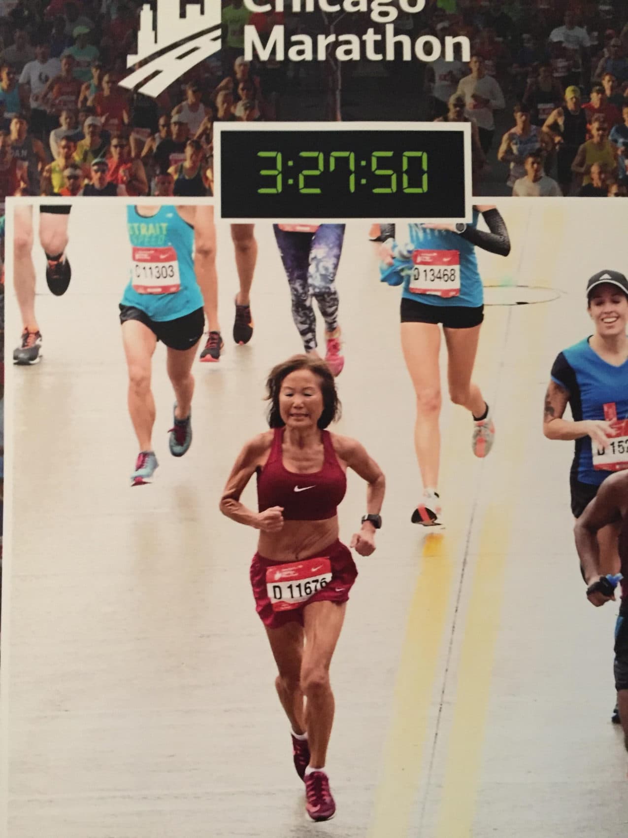 Jeannie Rice crossing the finish line at last month's Chicago Marathon, where she set a world record for her age group. (MarathonFoto/Courtesy of Jeannie Rice)
