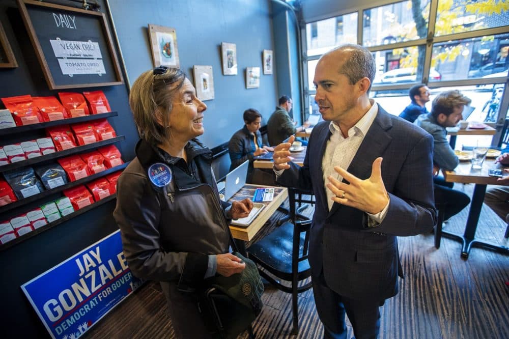 Gonzalez speaks with state Rep. Denise Provost at the cafe. (Jesse Costa/WBUR)
