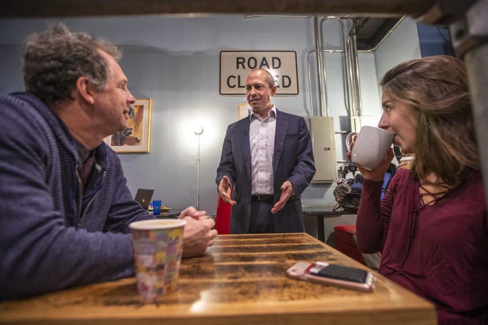 Gonzalez speaks with Ben Evett, left, and Jessica Ernst at the same coffee shop. (Jesse Costa/WBUR)