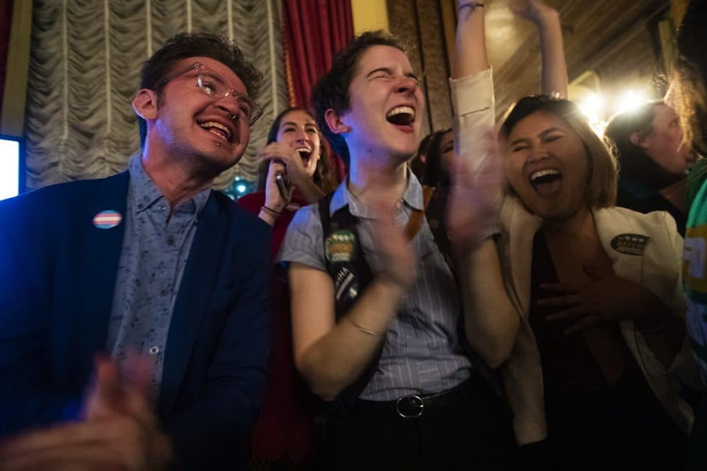 Supporters of the 'Yes on 3' campaign celebrate victory when it is announced Massachusetts voters decided to uphold a law offering transgender people protections in public accommodations. (Jesse Costa/WBUR)