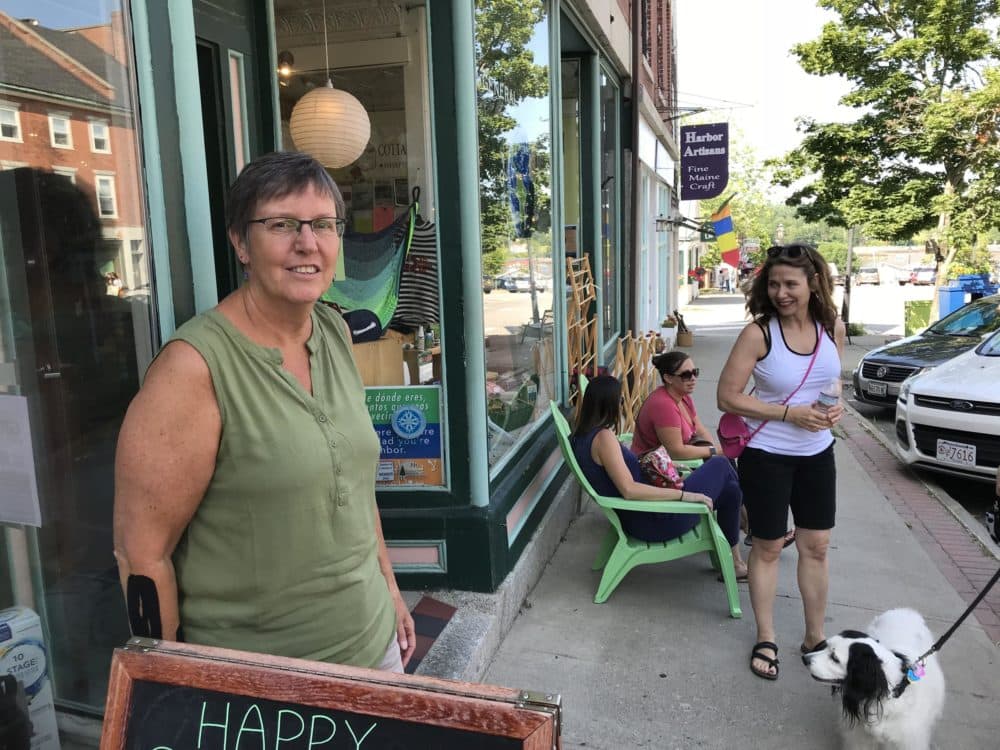 Ellie Daniels (left), owner of the Green Store in downtown Belfast, says a proposed indoor salmon farm is out of scale for the city, where residents focus on the arts, tourism and sustainable agriculture. (Fred Bever/Maine Public Radio)