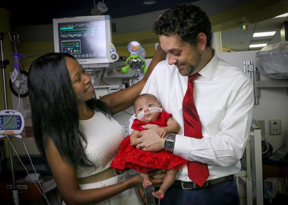 Jason and LaWanda Rosenberger smile as they pose for a family portrait with their baby, Aubree Lynn Rosenberger, at the NICU at Children’s Healthcare of Atlanta at Scottish Rite. (Courtesy of Kristy Williams, Dimples Photography Atlanta)