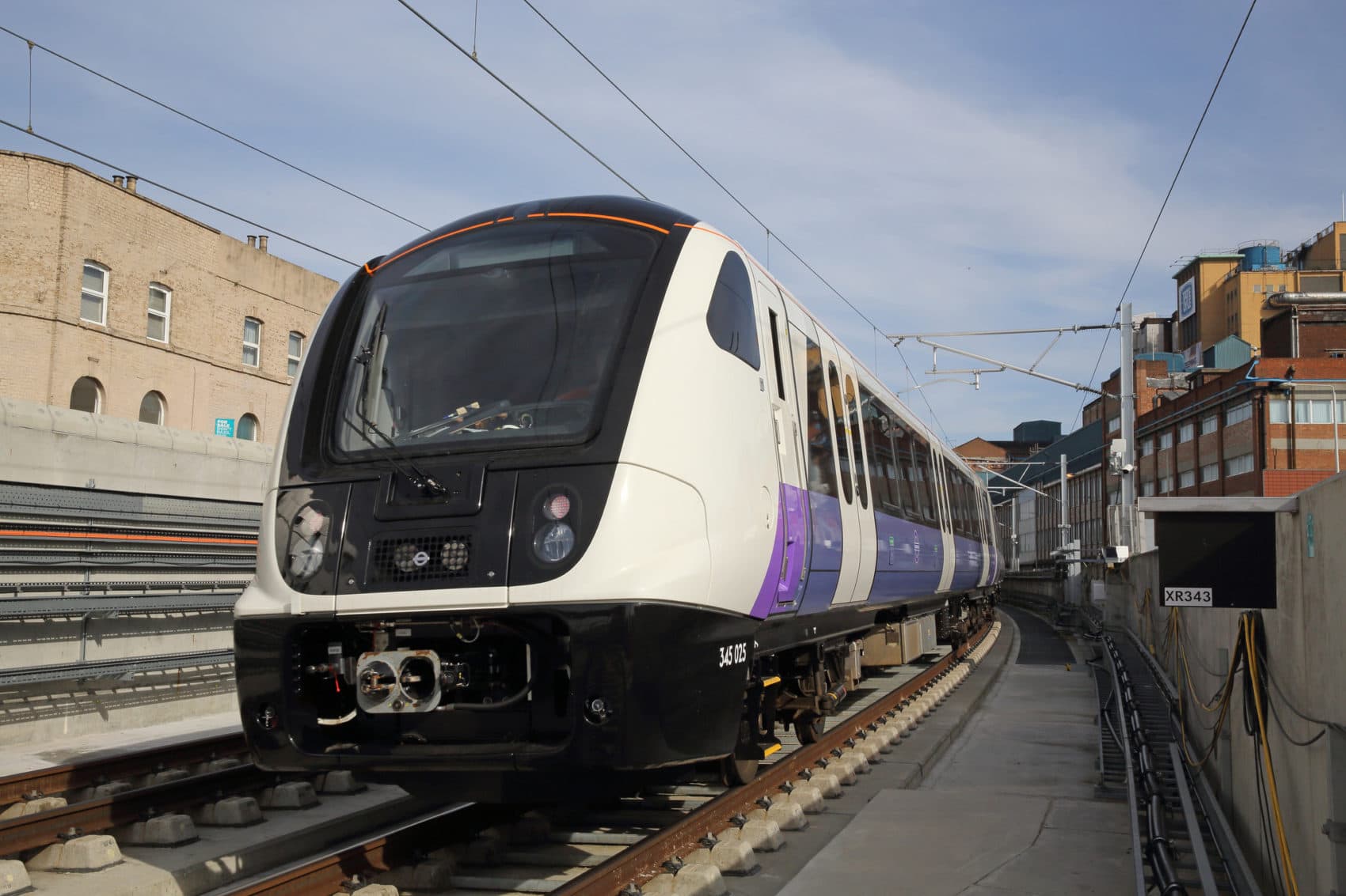 An Elizabeth Line test train passes through Custom House station in April 2018. (Courtesy of Crossrail)