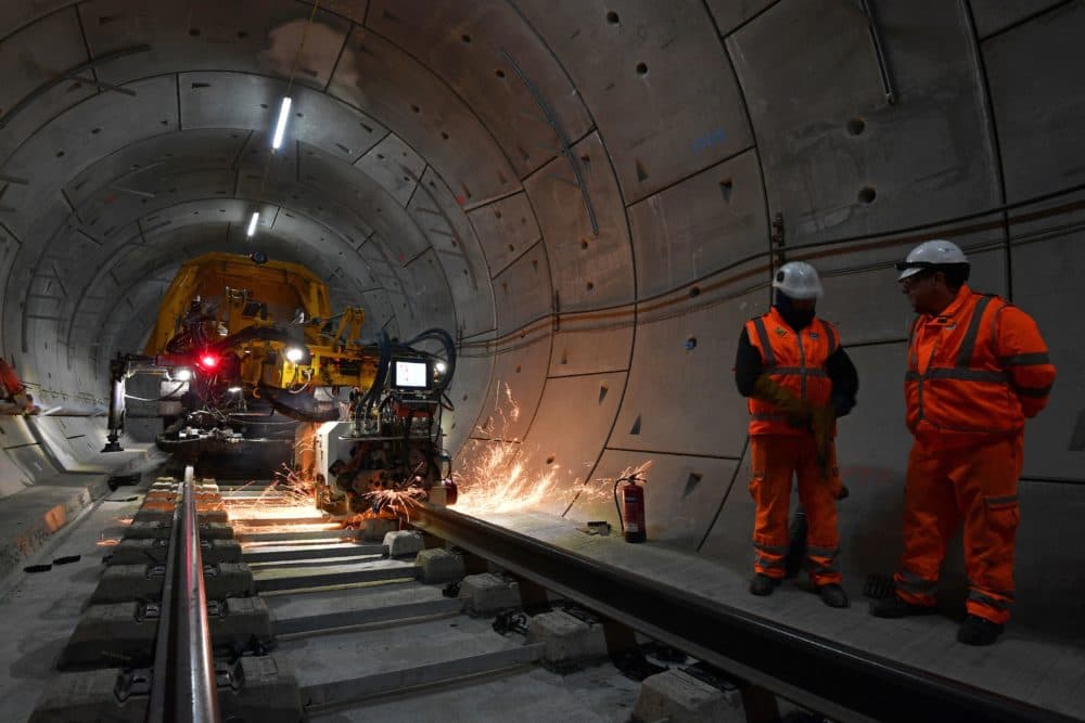 A machine welds a section of track inside a Crossrail tunnel, beneath Stepney in east London, on Nov. 16, 2016. (Ben Stansall/AFP/Getty Images)