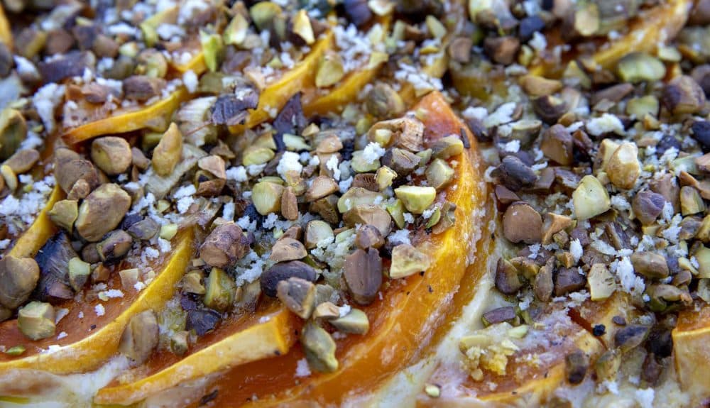 Chef Kathy Gunst’s squash and leek gratin with maple syrup and pistachio crumble. (Robin Lubbock/WBUR)